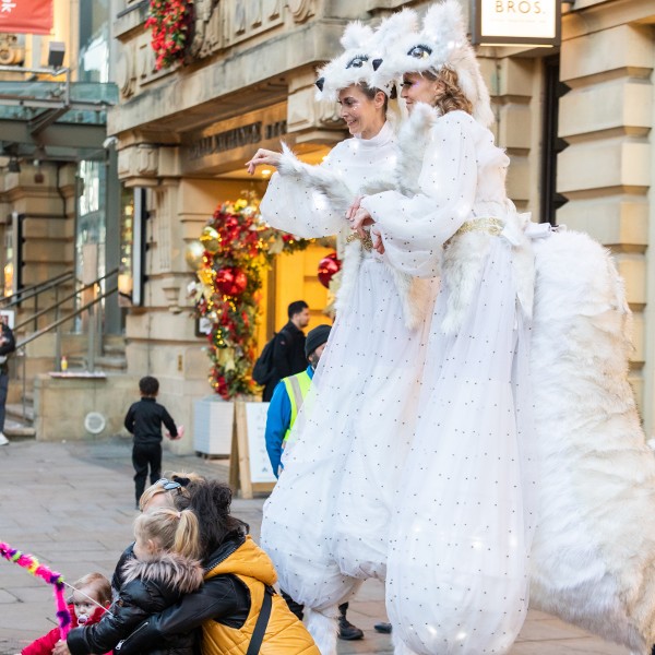 Snow Foxes Stilt Walkers